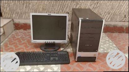 Gray Flat Screen Computer Monitor And Keyboard