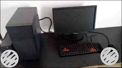 Black Flat Screen Computer Monitor And Keyboard